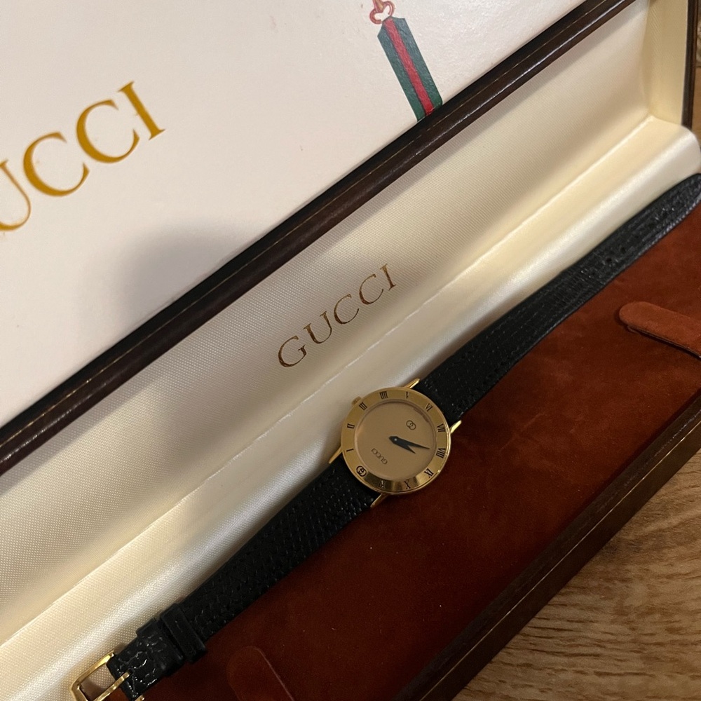 Gucci Black and Gold Watch